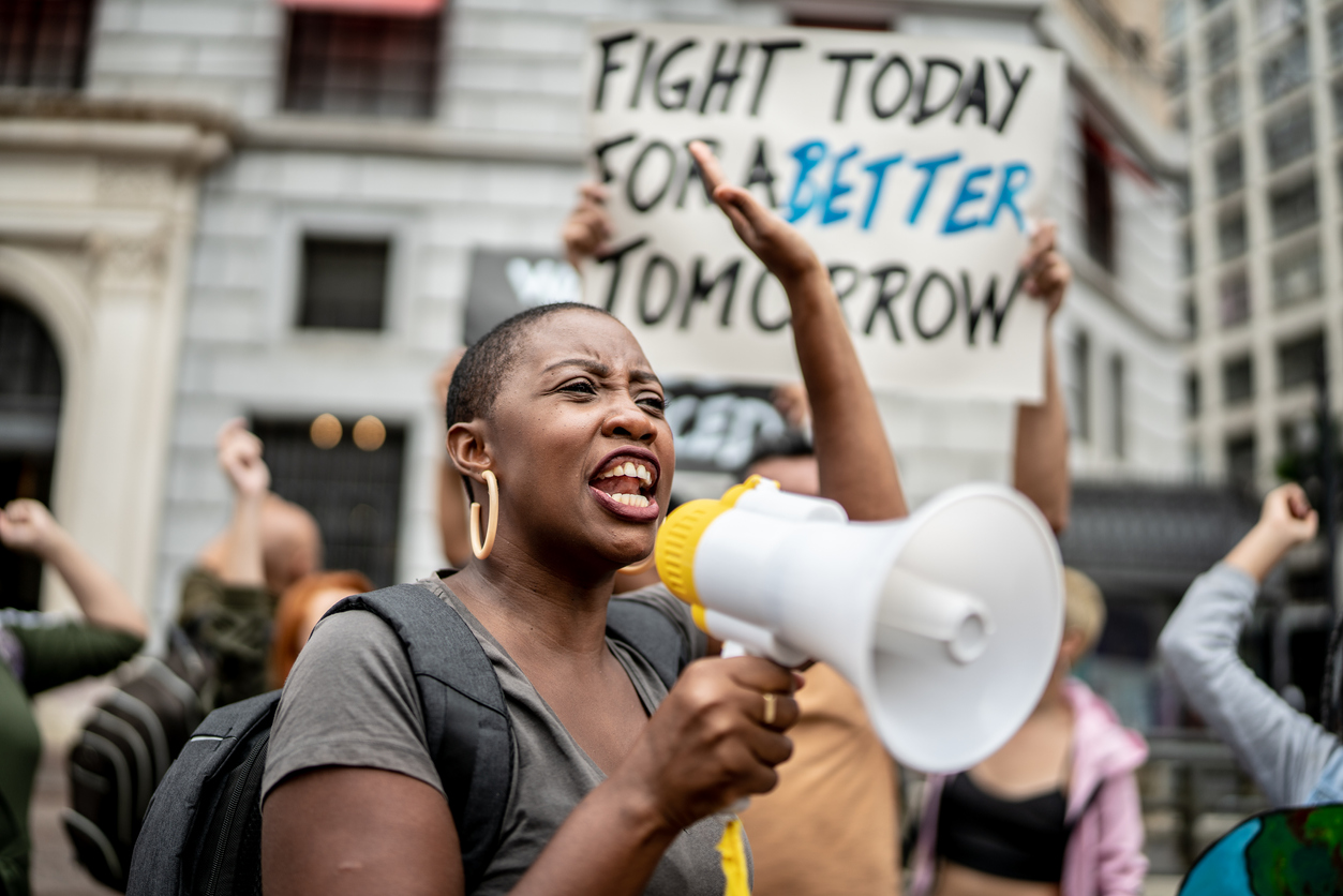 African american woman with a megaphone at a protest march